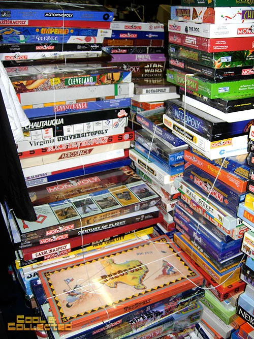 Stacks of Monopoly editions.
