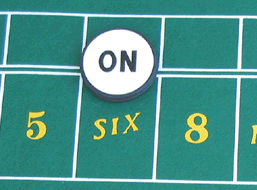 Craps On Puck the point is six.