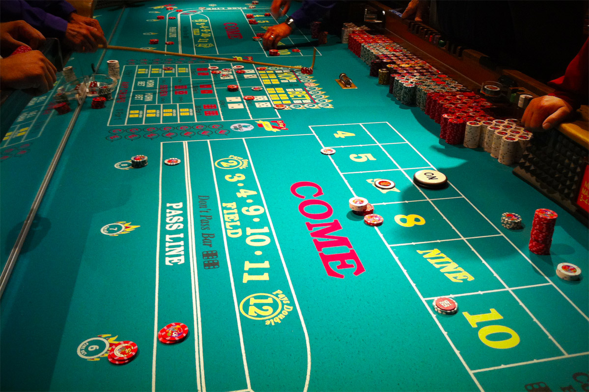 Craps table with Chips, Dice, and Player's hands